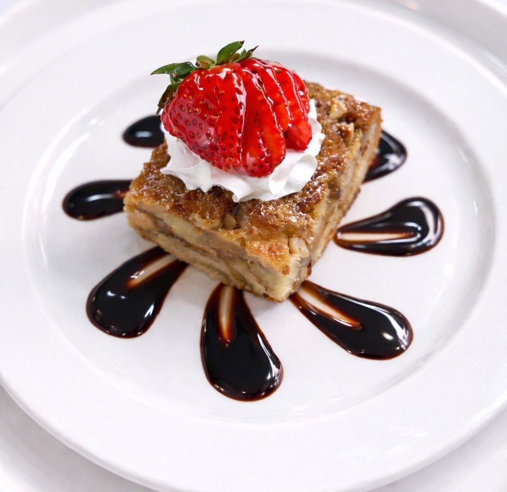 Dessert cake with strawberry and chocolate sauce